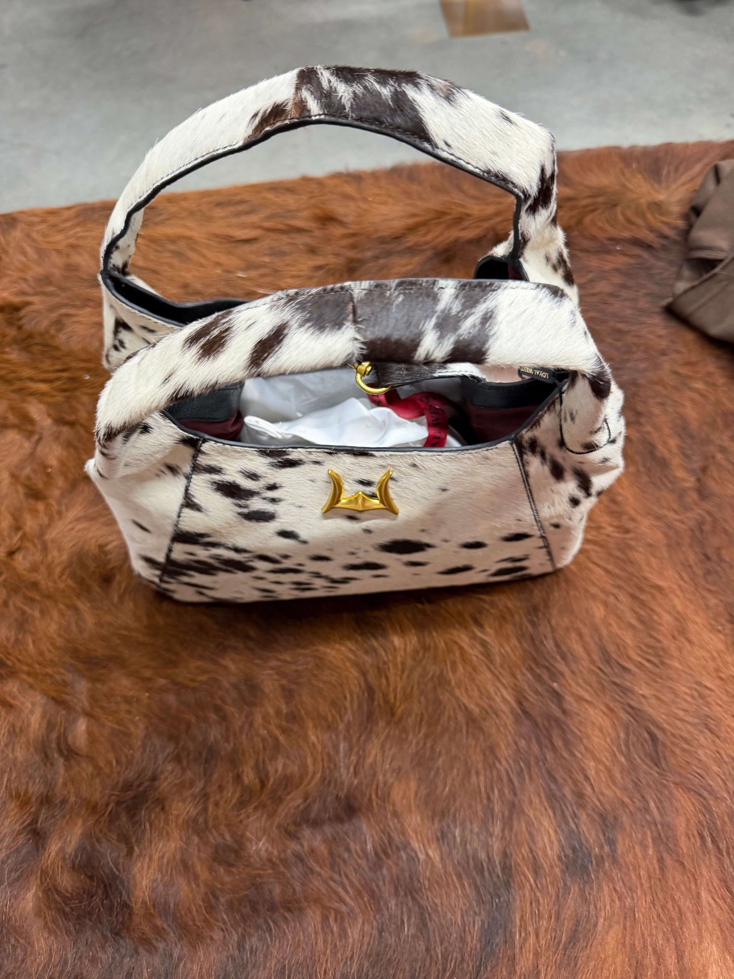 Loyal West Vita Servans hobo bag with cowgirl charm, concealed carry design, made of brown leather with decorative accents