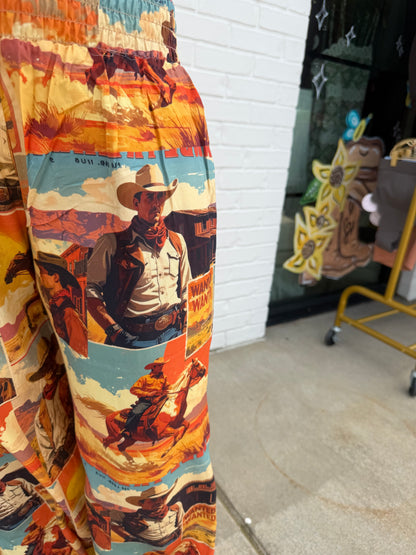 Lucky & Blessed high-rise pants with multi western collage print, showcasing stylish design and vibrant pattern.