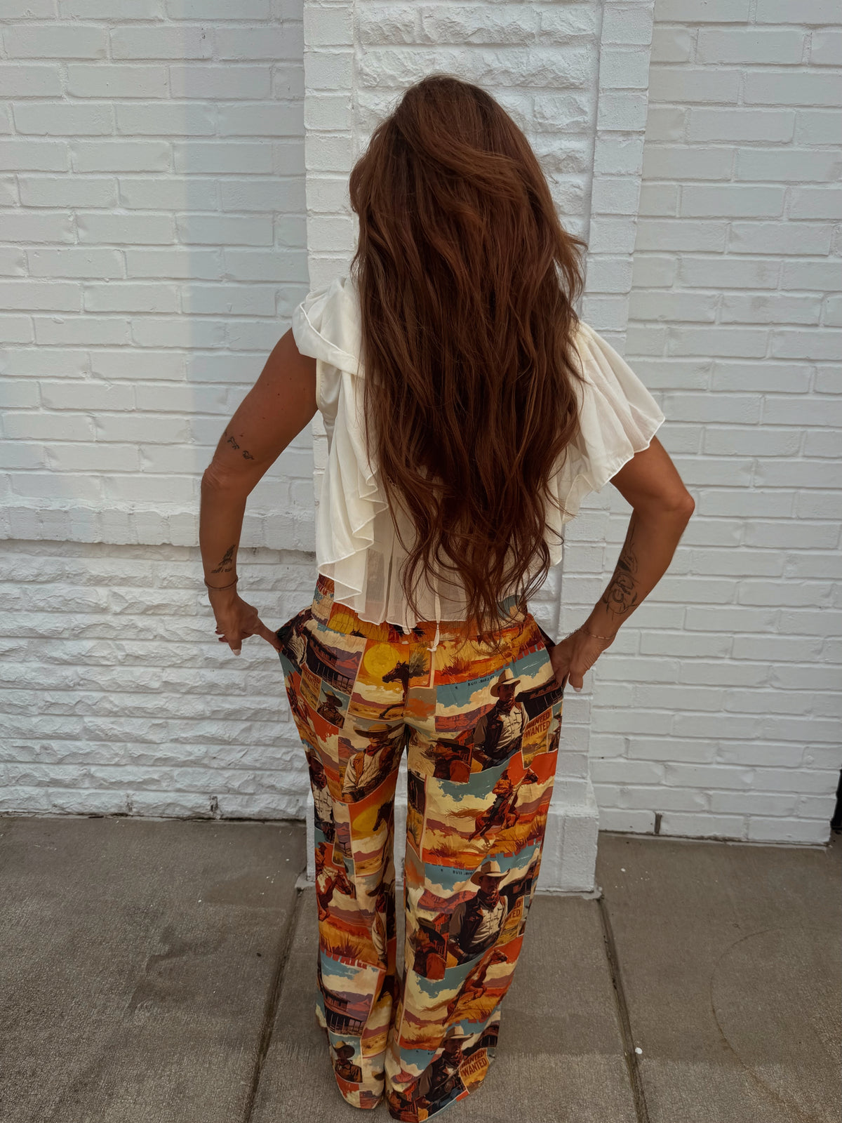 Lucky & Blessed multi Western collage printed high-rise pants with colorful patchwork and bold design.