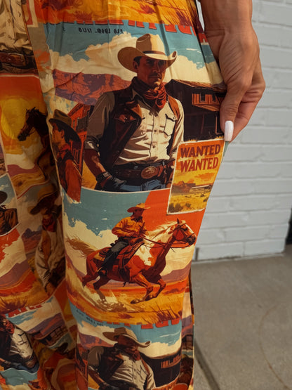 Lucky & Blessed multi western collage printed high-rise pants with vibrant design and comfortable fit, shown on a model.