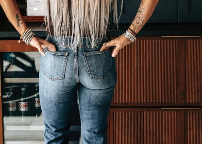 Haala Denim Bella flare trousers in indigo stone with gold accents, showcasing stylish denim bottoms for a trendy look.
