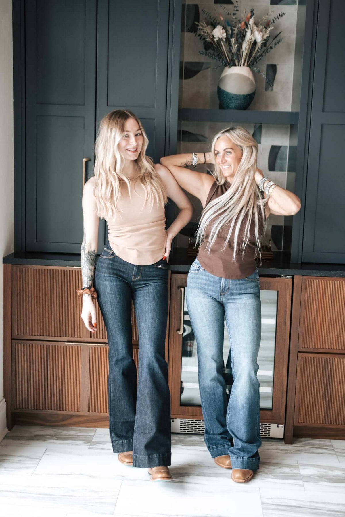 Haala Denim Bella flare jeans in deep ocean blue with gold accents, showcasing stylish bottoms with a flared silhouette.