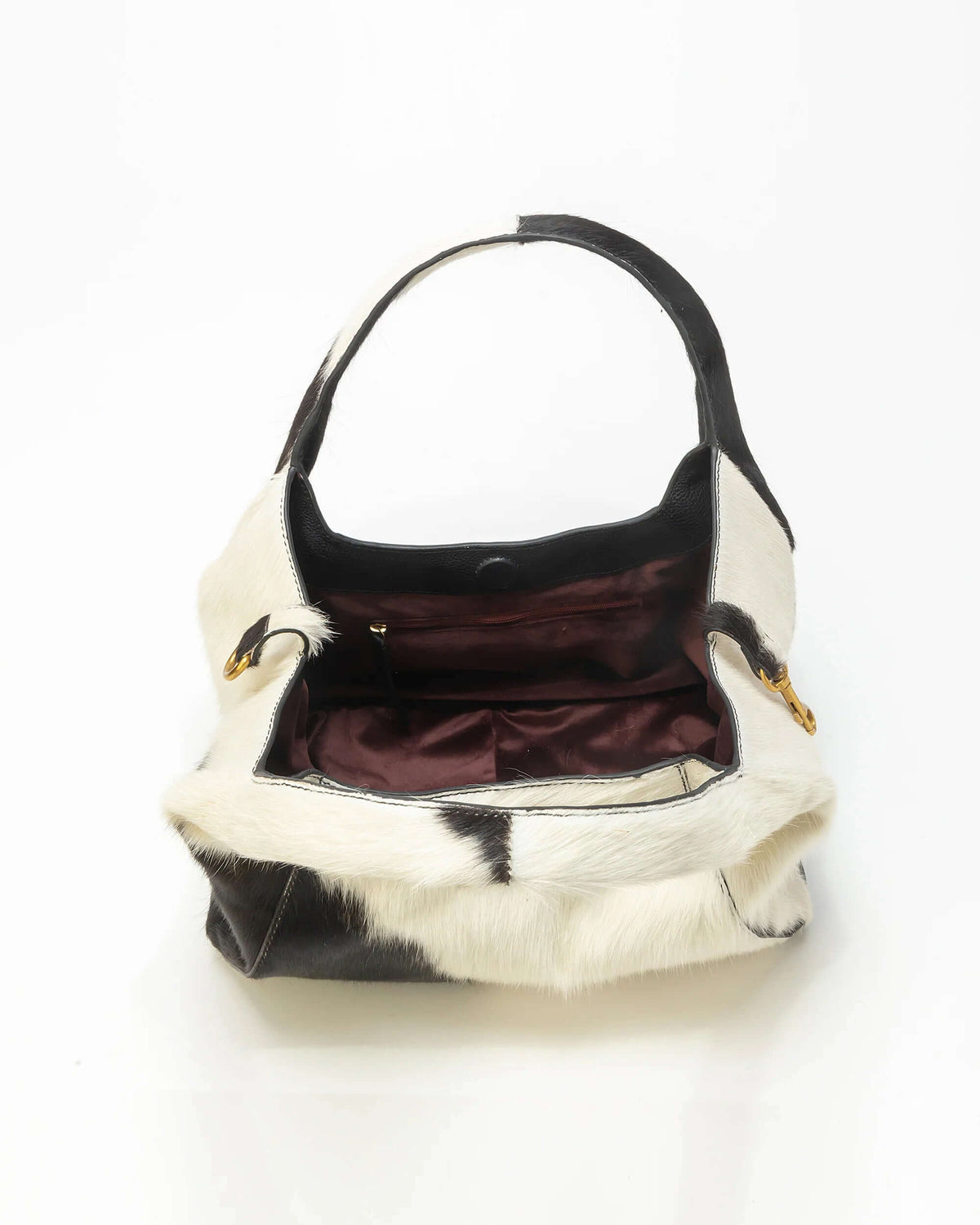 Loyal West Vita Servans hobo bag with cowgirl charm, concealed carry design, in brown leather with decorative stitching.