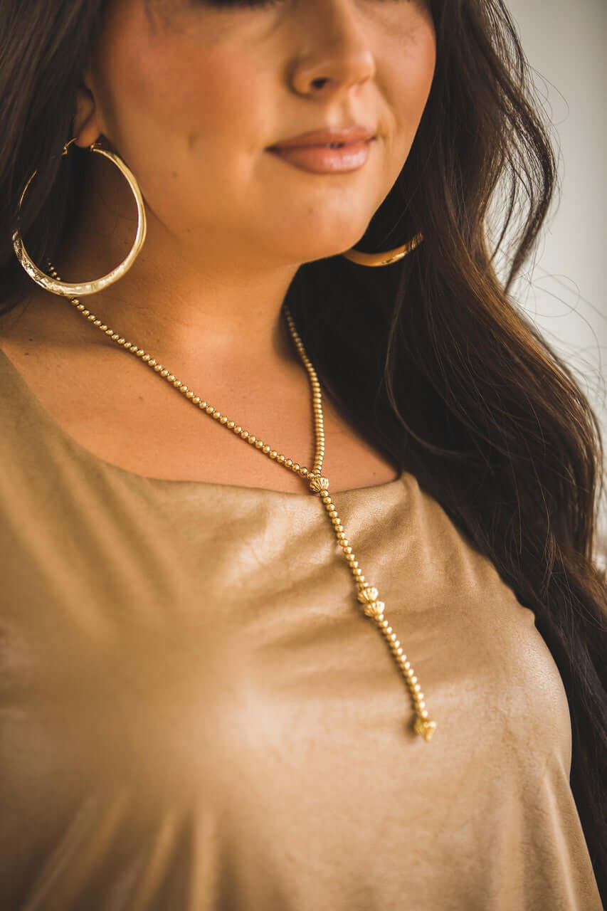 18-inch 18K gold plated beaded Y necklace with 5-inch tail, available in white and yellow gold, by West & Co. jewelry.