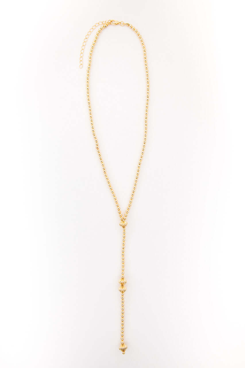 22-inch gold-plated Y necklace with turquoise accents and 5.5-inch tail, featuring West & Co. branding in a close-up image.