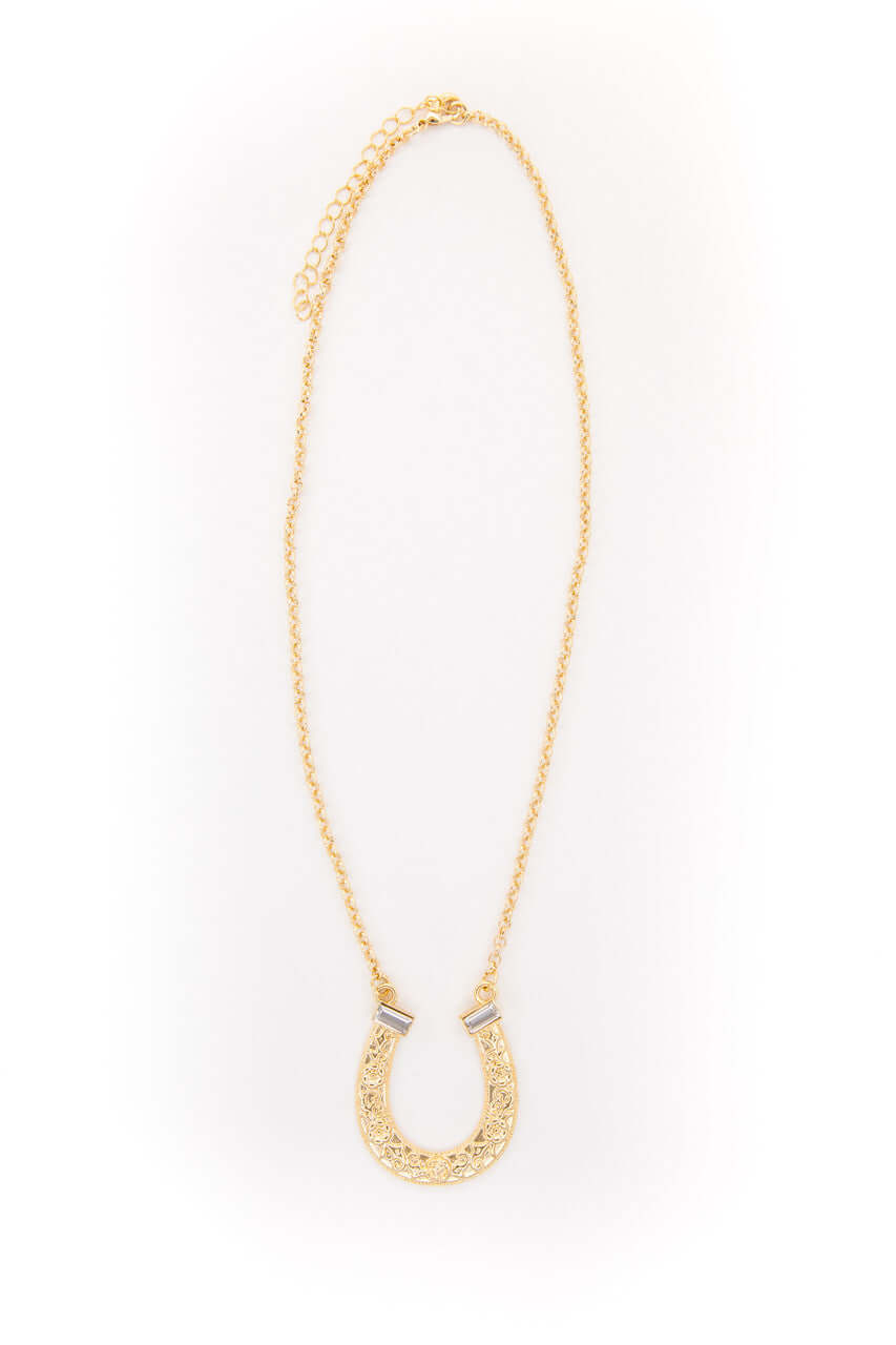 18-inch gold-plated horse shoe necklace with rhinestone accents by West & Co. jewelry, showcasing a detailed and stylish accessory.