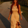 Lucky & Blessed champagne satin maxi dress with ruffle details and a slit, perfect for elegant occasions.
