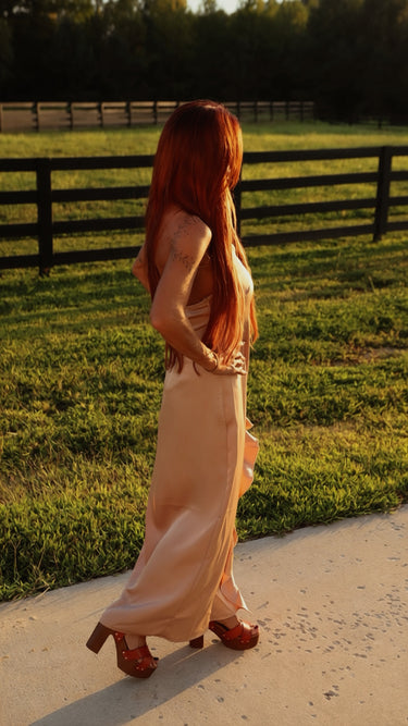 Lucky & Blessed champagne satin maxi dress with ruffle details and a slit, perfect for elegant occasions.