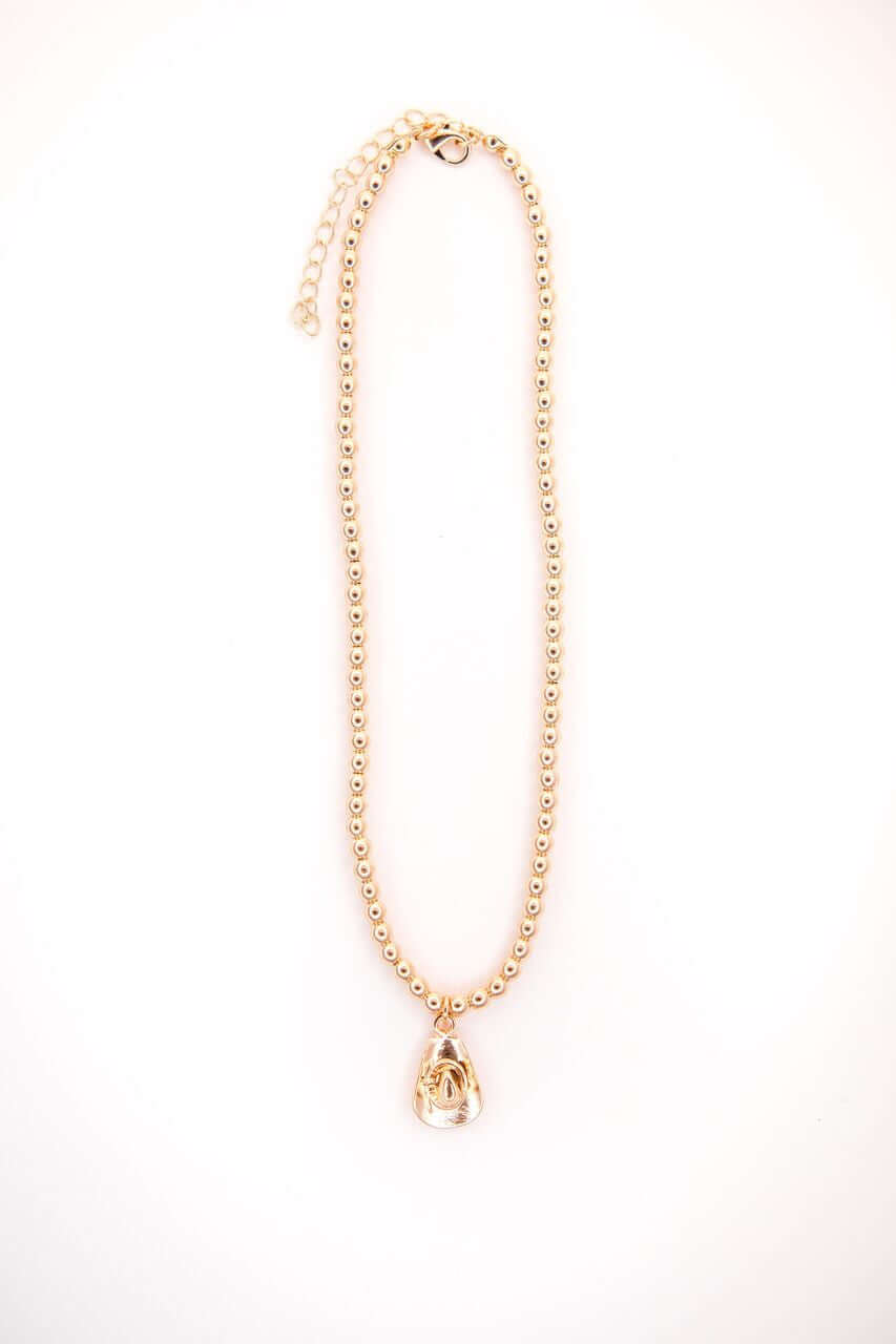 18k gold plated dainty beaded necklace with cowboy hat charm by West & Co., stylish jewelry accessory.