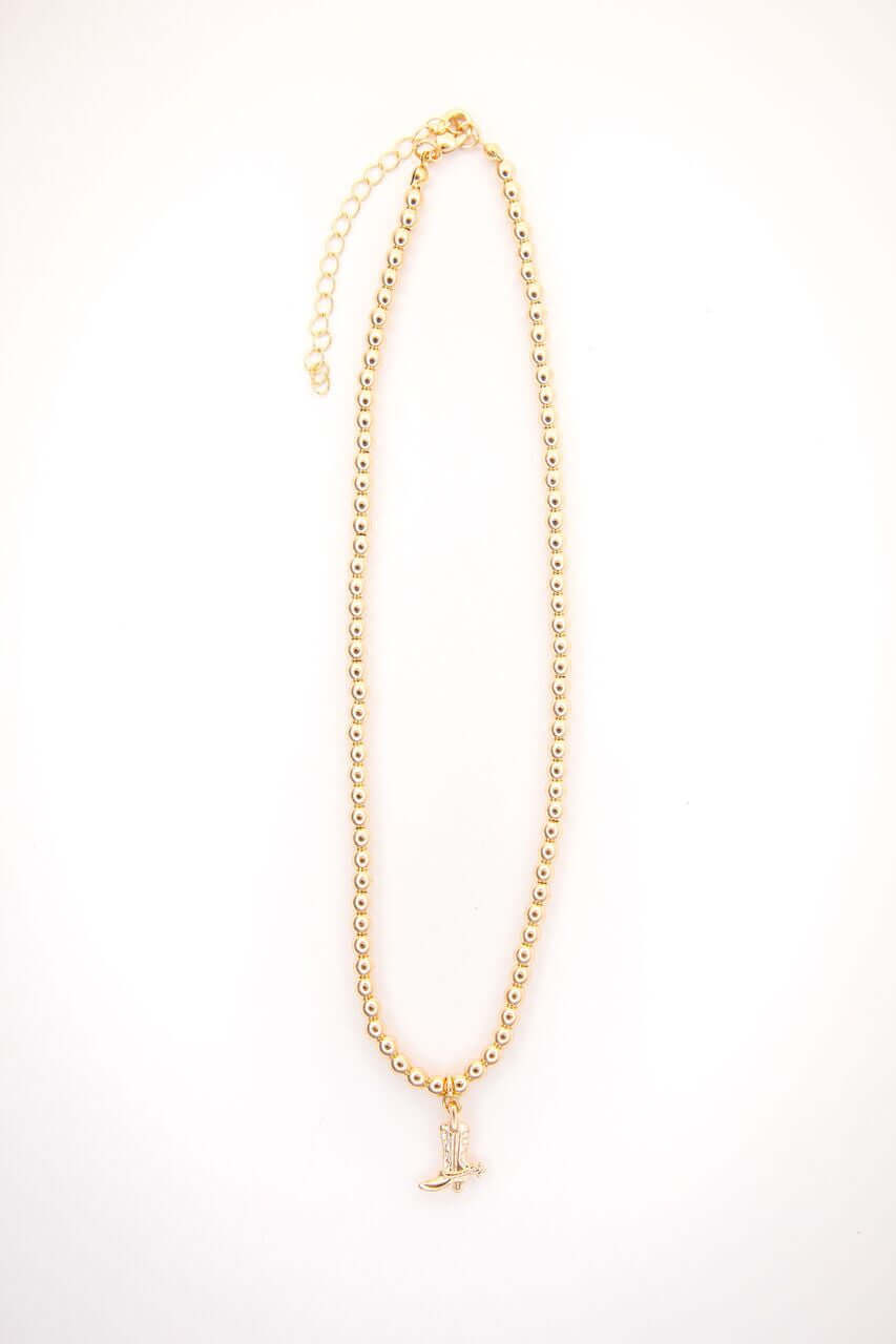 14-inch gold-plated beaded necklace by West & Co. featuring a charming cowboy boot pendant on a delicate chain.