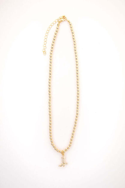 14-inch gold-plated beaded necklace by West & Co. featuring a charming cowboy boot pendant on a delicate chain.