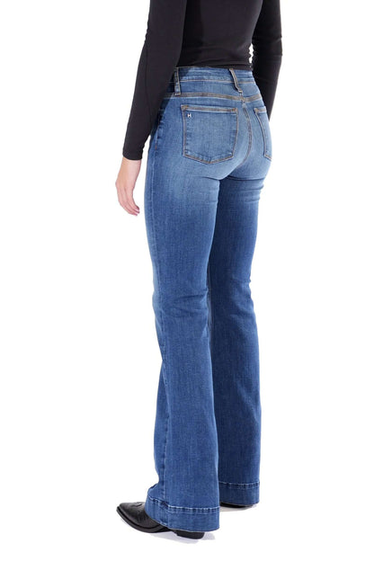 Haala Denim Bella flare trousers in indigo stone with gold accents, showcasing stylish denim bottoms with a flared fit and trendy design.