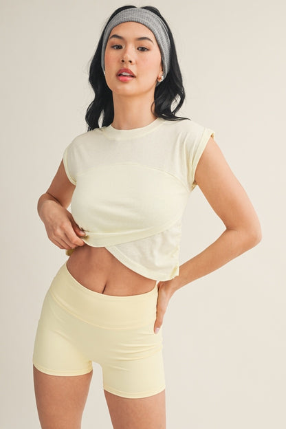 Kimberly C crossover top featuring a stylish design, long sleeves, and a flattering fit, perfect for casual or office wear.