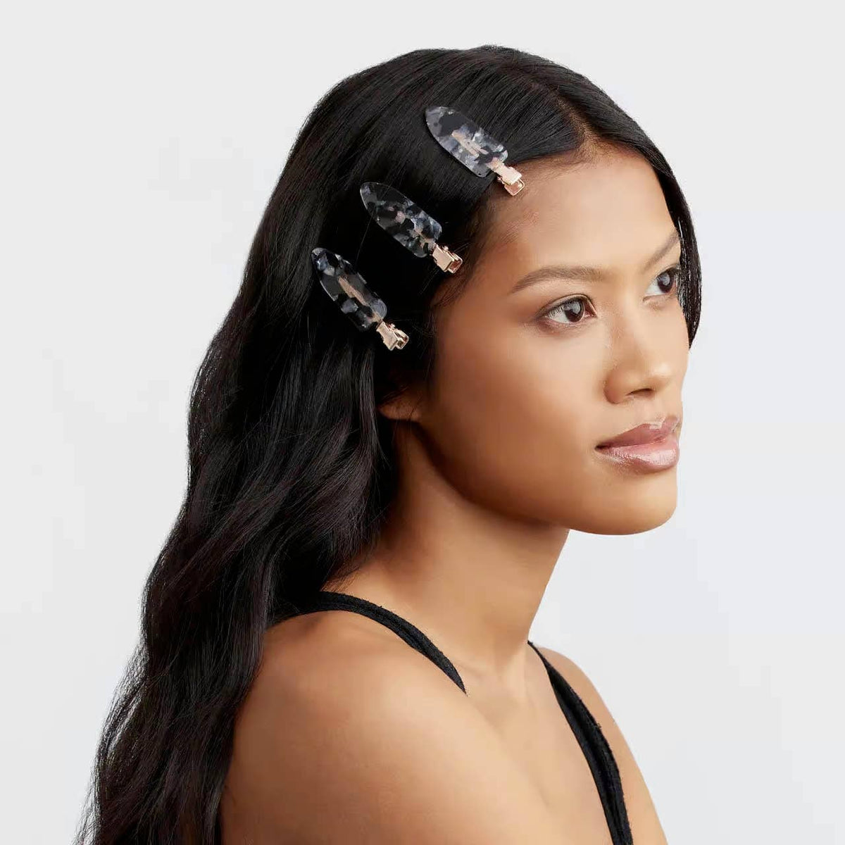 KITSCH eco-friendly creaseless hair clips set in black terrazzo pattern, four-piece collection for styling and sectioning hair.