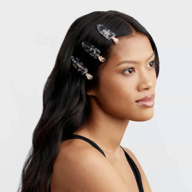 KITSCH eco-friendly creaseless hair clips set in black terrazzo pattern, four-piece collection for styling and sectioning hair.