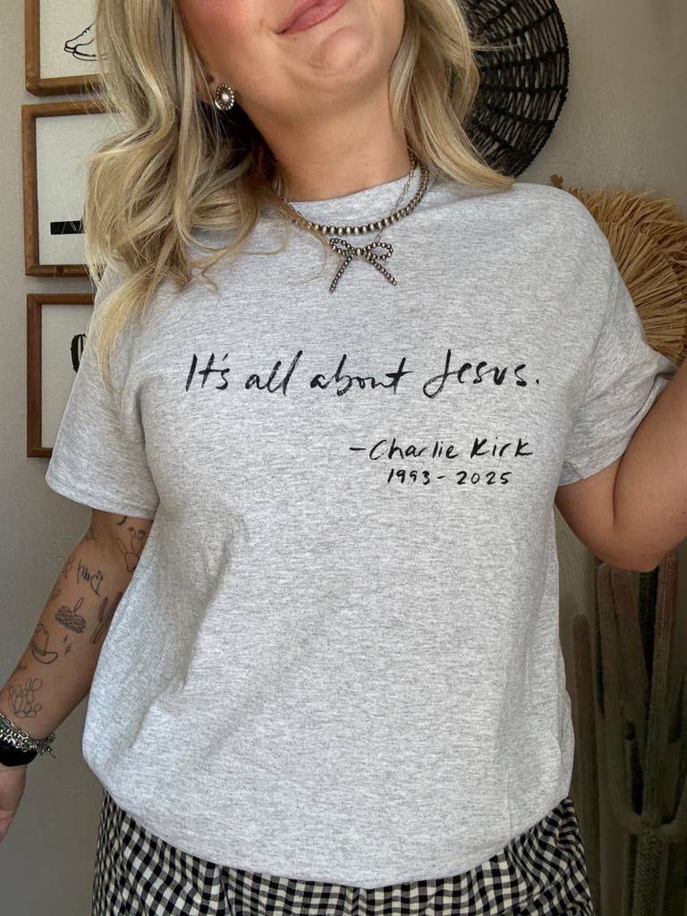 Graphic T-shirt by The Walking A featuring a design inspired by the theme "All About Jesus" on a casual tee.