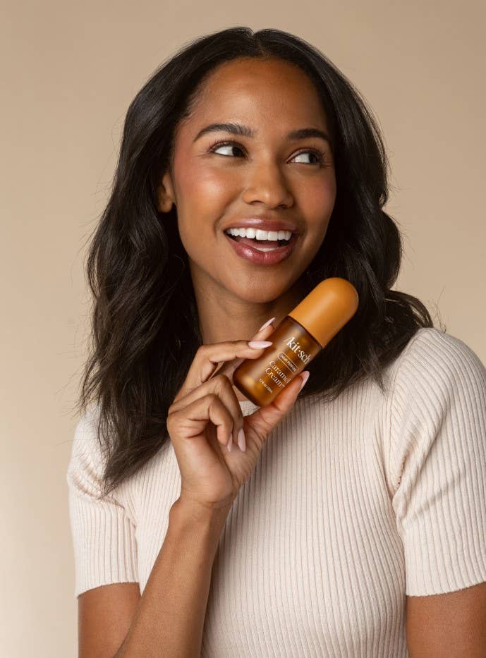 KITSCH Caramel Cream Hair & Body Perfume Mist bottle with caramel-colored liquid and floral accents on the label.