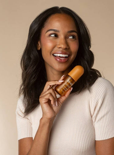 KITSCH Caramel Cream Hair & Body Perfume Mist bottle with caramel-colored liquid and floral accents on the label.