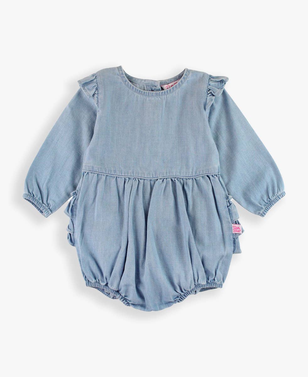 Baby girl wearing a light wash long sleeve flutter bubble romper by RuffleButts + RuggedButts, suitable for kids and baby girls.