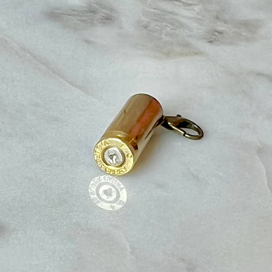 Dandee Bullet Charm for .30 Super Carry firearm, jewelry accessory with a metallic finish and detailed bullet design.