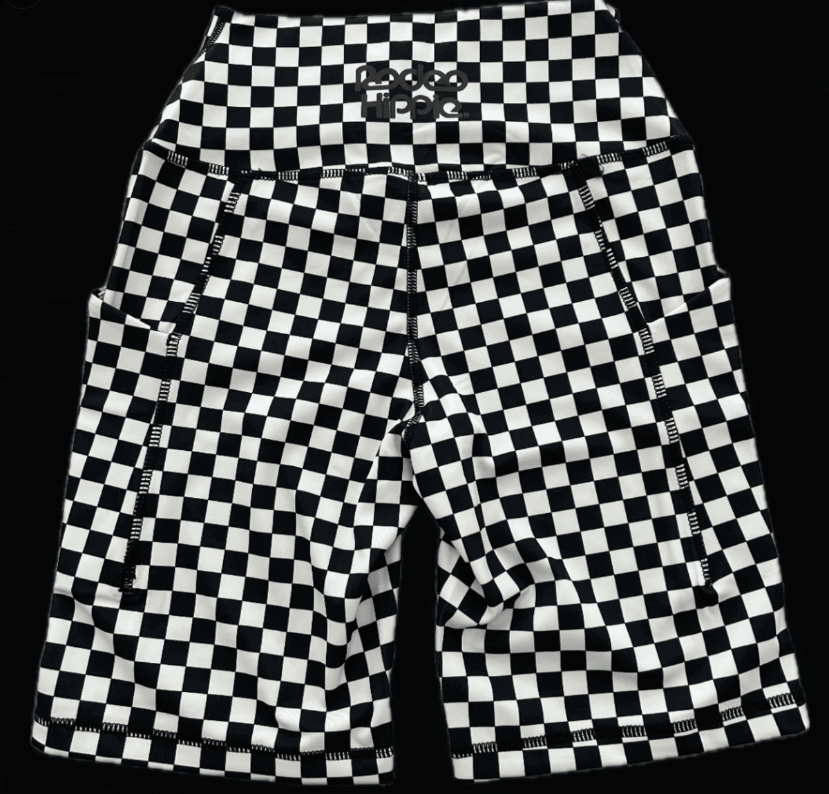 Rodeo Hippie checkered biker shorts in black and white activewear with a snug fit and high waist for sporty style.