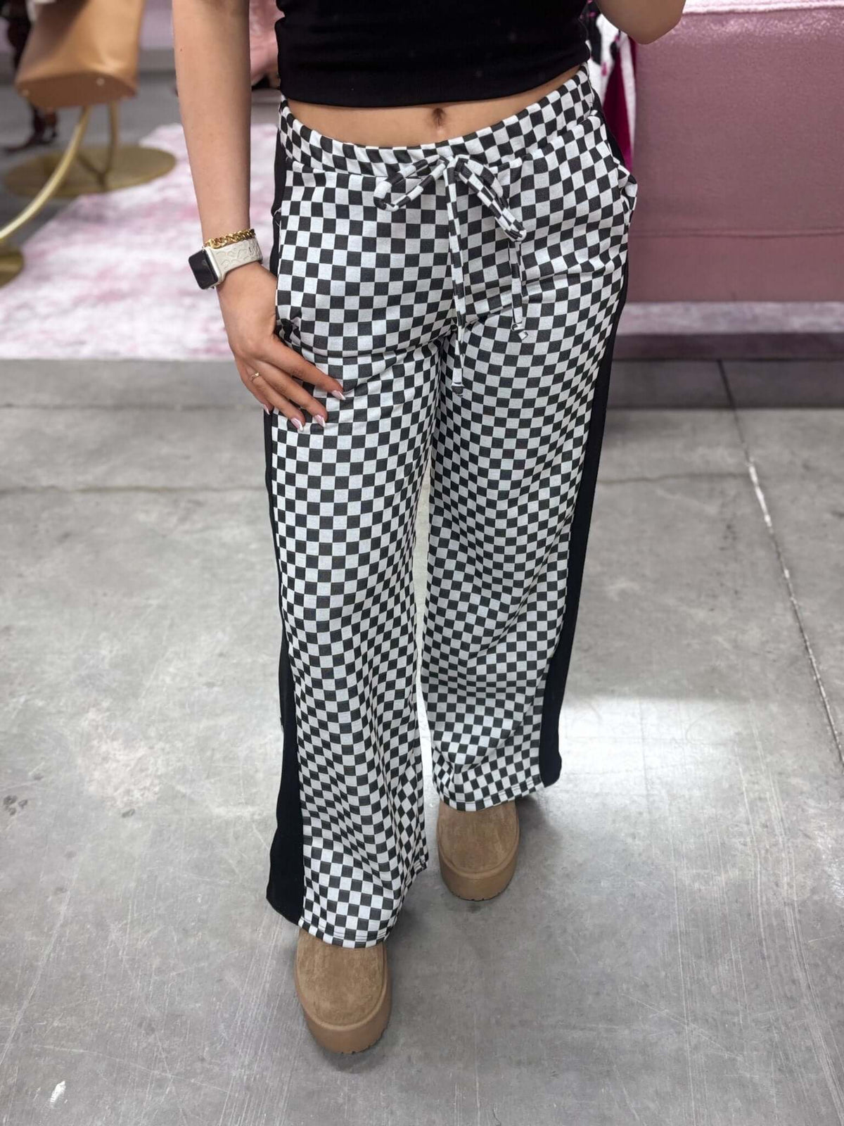 Stylive checkered lounge pants with a relaxed fit and elastic waistband, featuring a black and white checkered pattern.