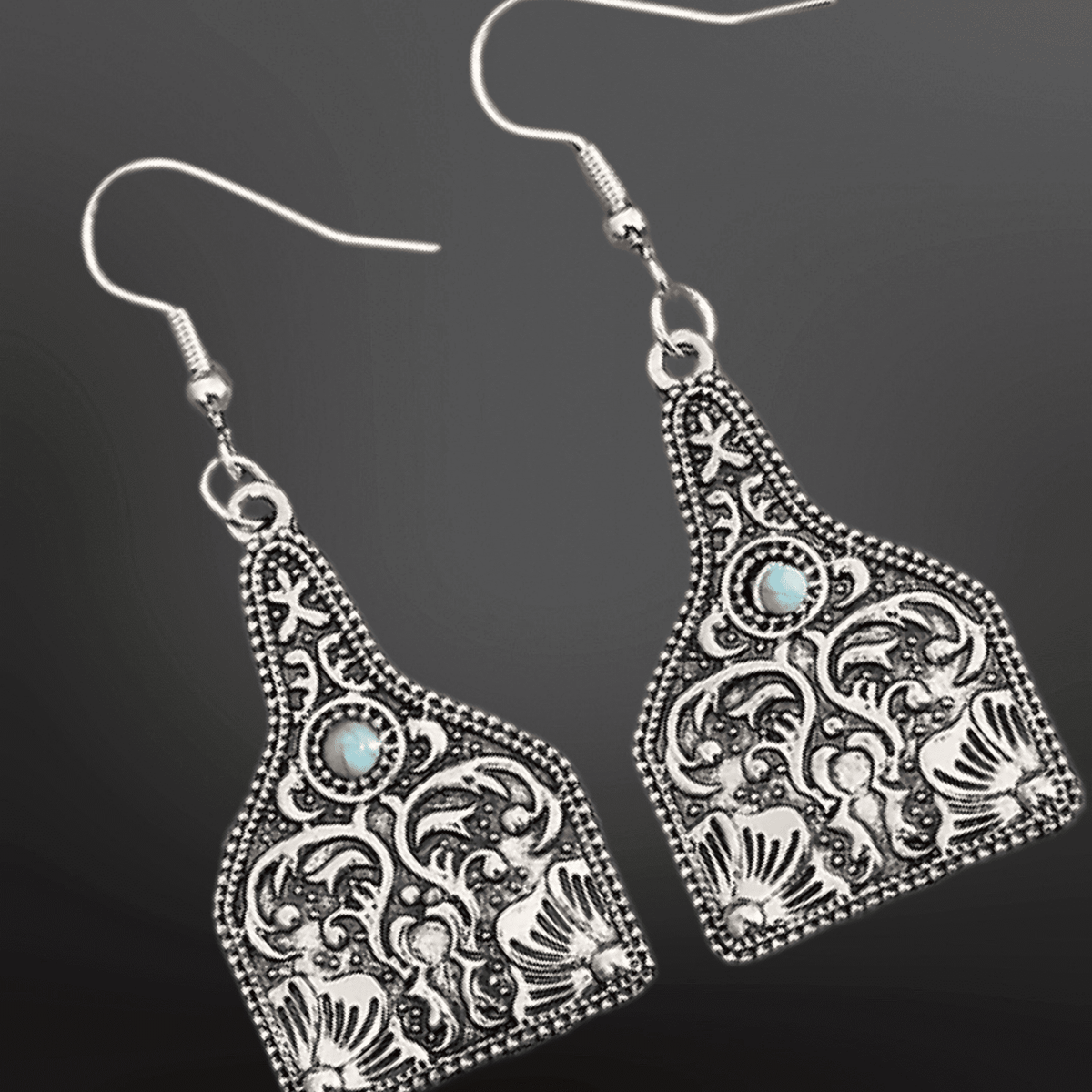 Western faux turquoise earrings featuring cow-tag design by Westrian International, stylish jewelry accessory.