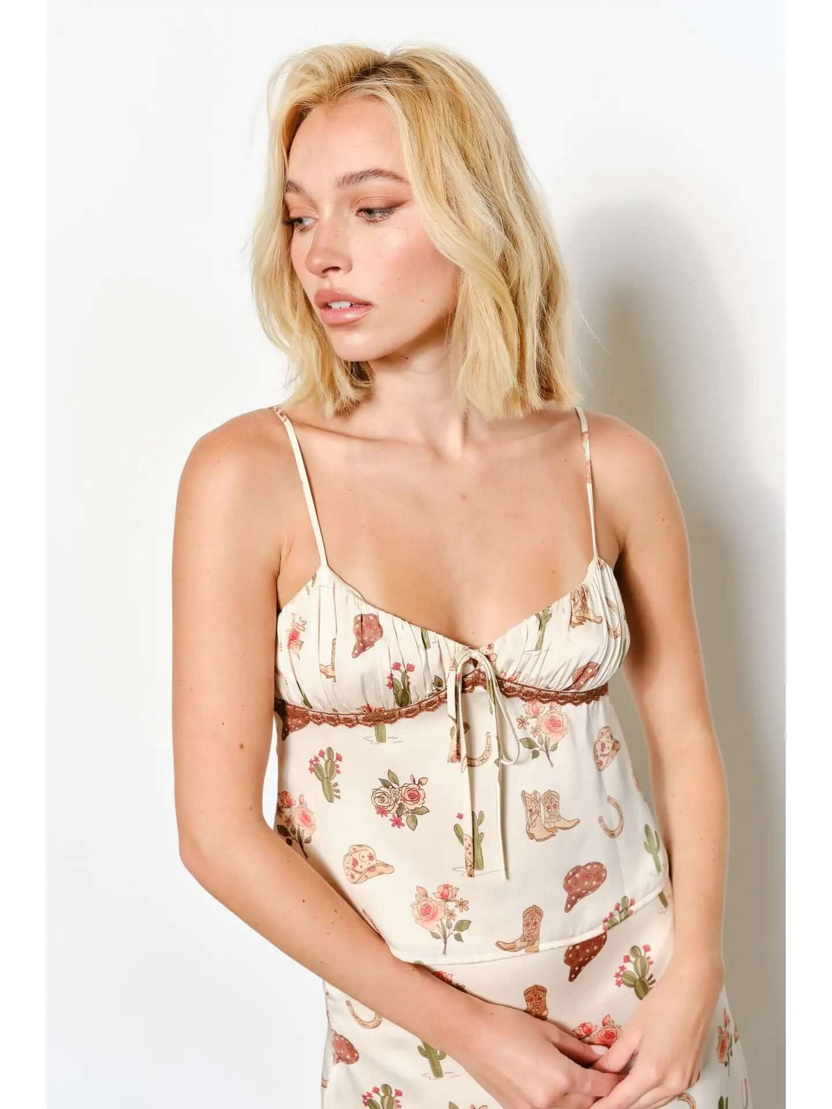 Pretty Garbage cowboy print cami top with spaghetti straps and lightweight fabric, perfect for casual summer wear.