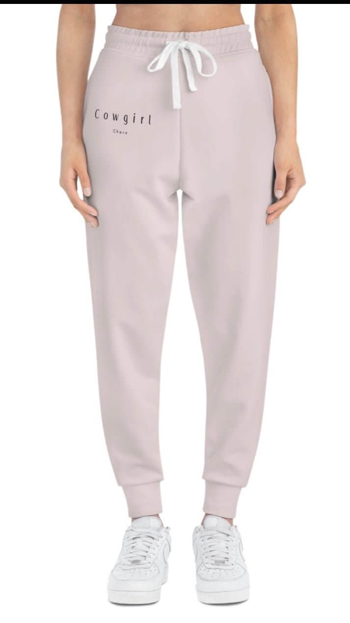 Cowgirl Charm athletic joggers in black with side pockets and cowgirl charm logo, casual bottoms for active wear.