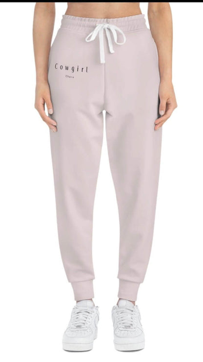 Cowgirl Charm athletic joggers in black with side pockets and cowgirl charm logo, casual bottoms for active wear.