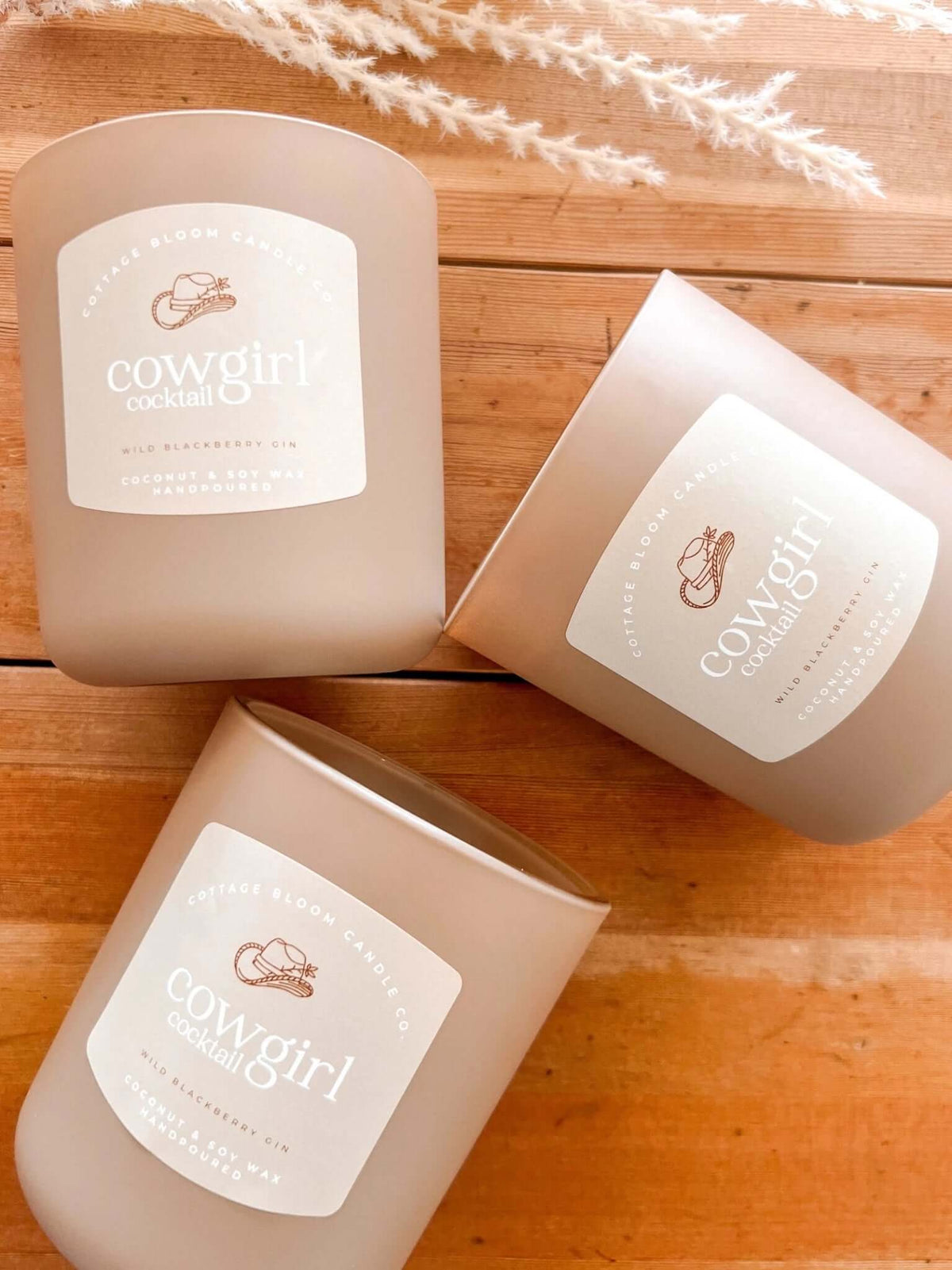 Cowgirl Cocktail Candle by Cottage Bloom Candle Co. featuring a decorative candle with a Western-inspired design.