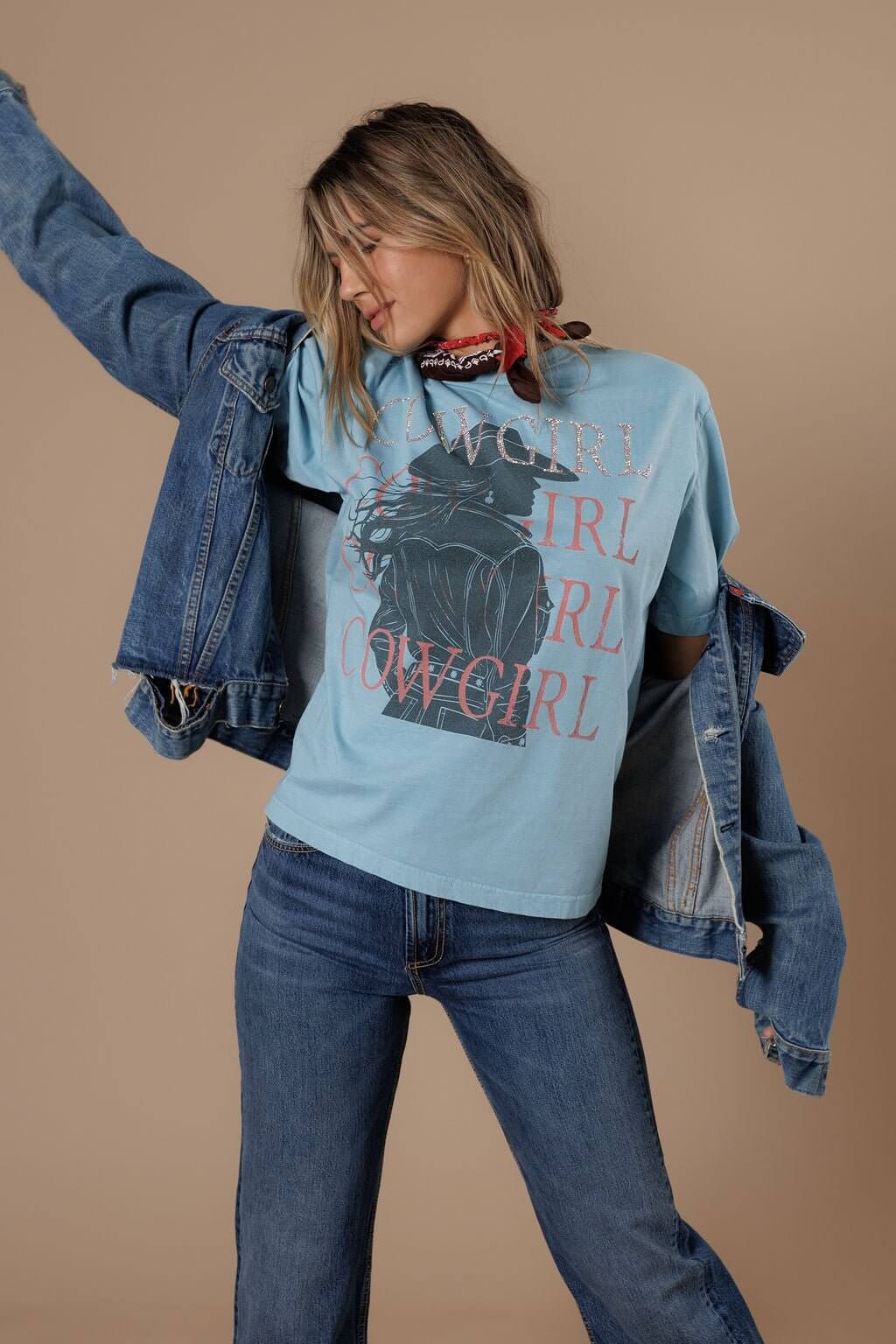 All Us Cowgirl Cowgirl Tee featuring a colorful graphic design on a casual cotton T-shirt for women.