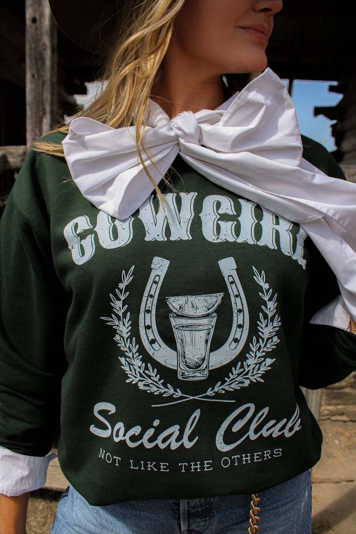 Cream-colored Cowgirl Social Club crewneck sweatshirt by Summer Tees featuring a graphic design with a cowgirl and western-themed elements.