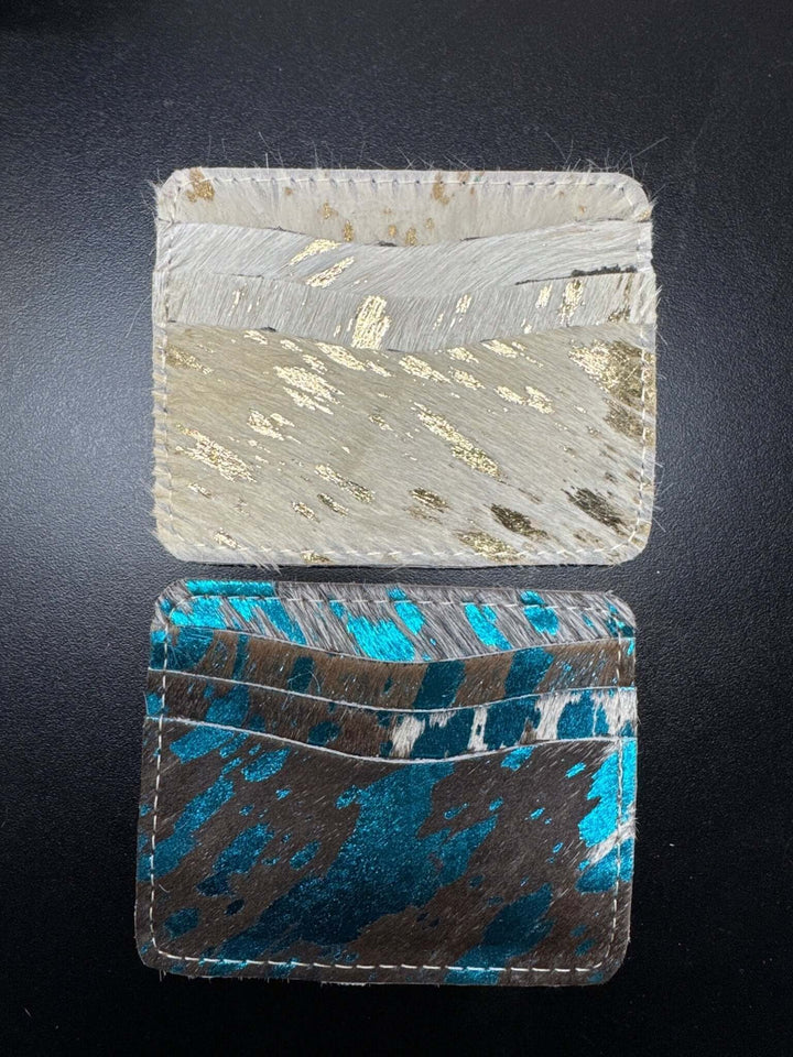 Cowhide wallet from Cowgirl Charm, a stylish leather accessory featuring natural cowhide pattern and compact design.