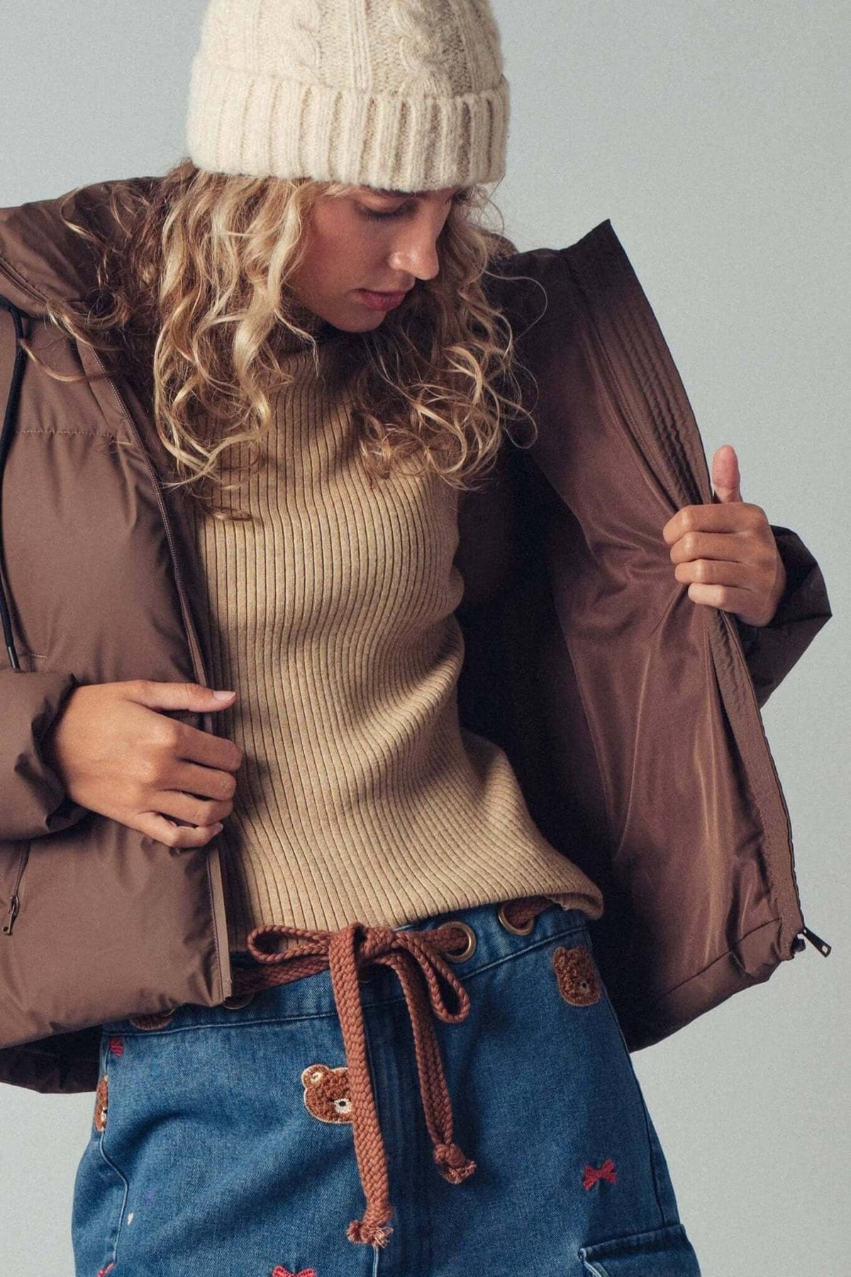 Urban Daizy cozy drawstring hooded puffer jacket, stylish outerwear with a warm, padded design and adjustable hood.