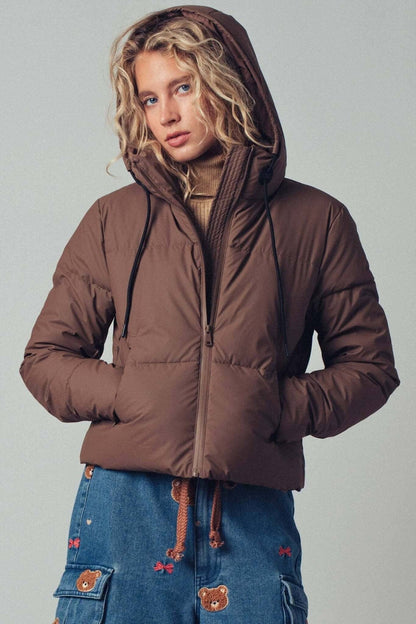 Urban Daizy cozy drawstring hooded puffer jacket, warm outerwear with a padded design and adjustable hood for cold weather.