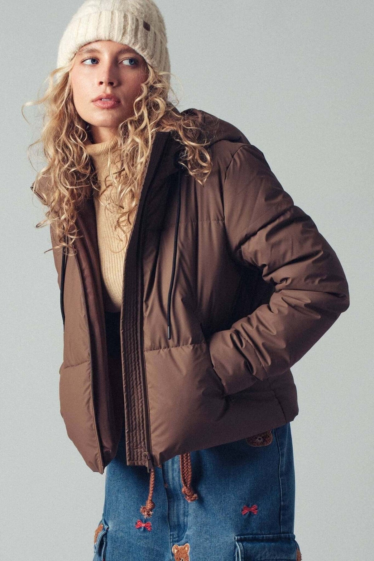 Urban Daizy cozy drawstring hooded puffer jacket, stylish outerwear with a warm, quilted design and adjustable hood.