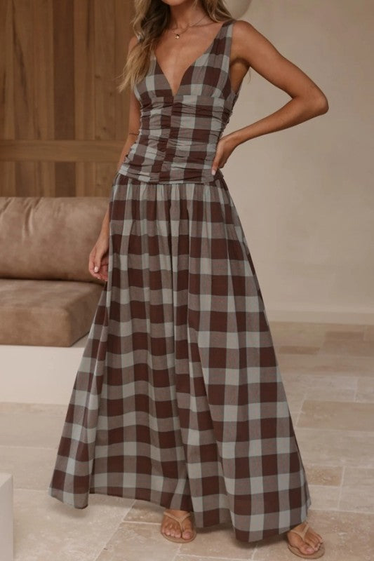 Brown plaid maxi dress with ruched bodice by Sunday Up, featuring a flowing silhouette and stylish plaid pattern.