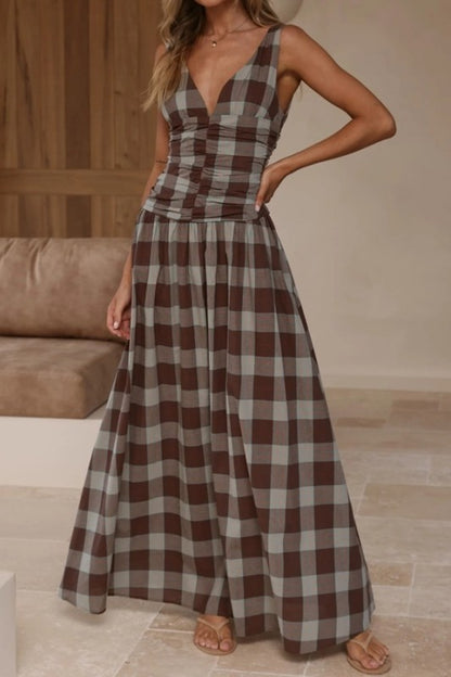 Brown plaid maxi dress with ruched bodice by Sunday Up, featuring a flowing silhouette and stylish plaid pattern.