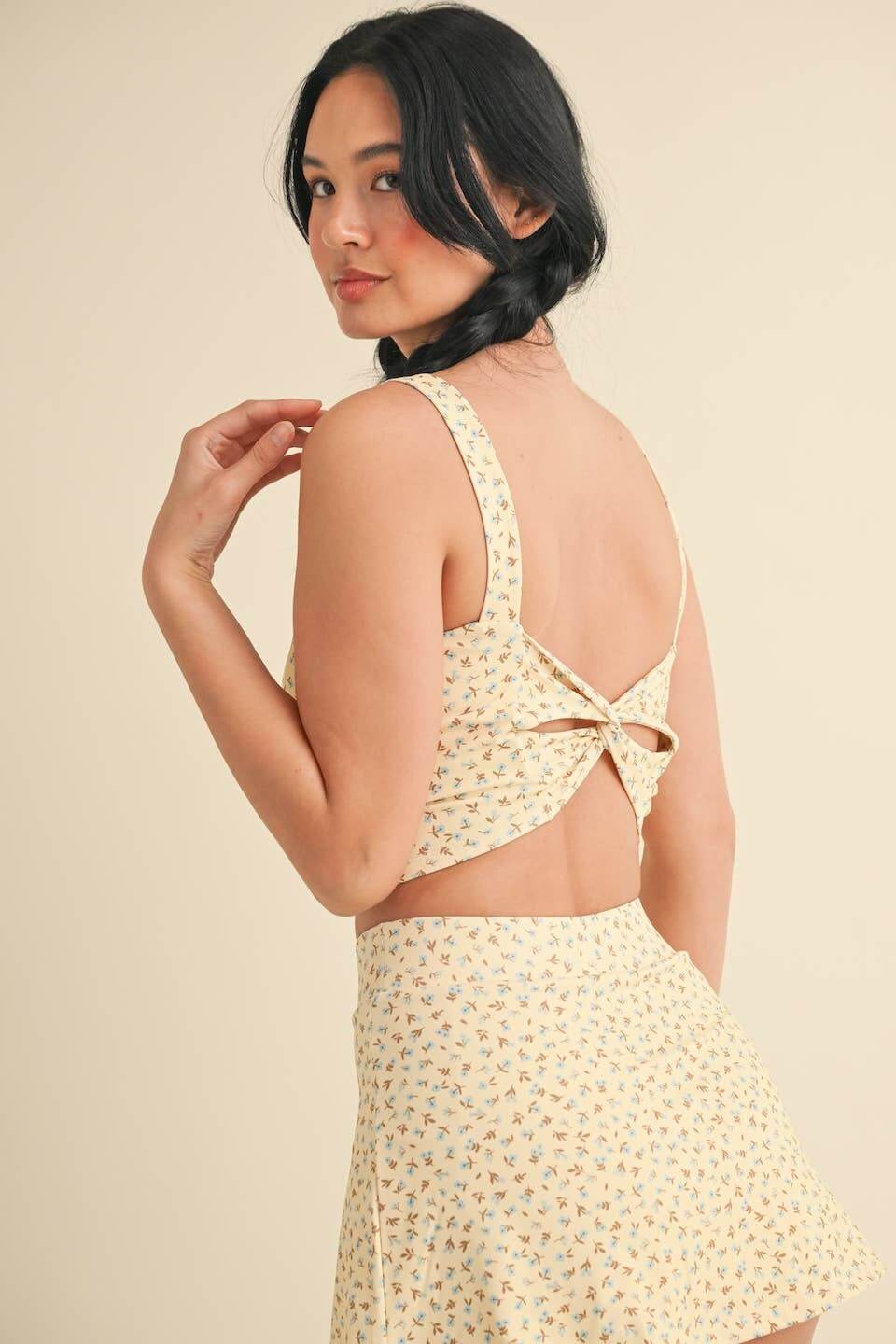 KIMBERLY C Ditsy Print Twist Back Crop Tank featuring a floral print and twisted back design for a stylish summer look.