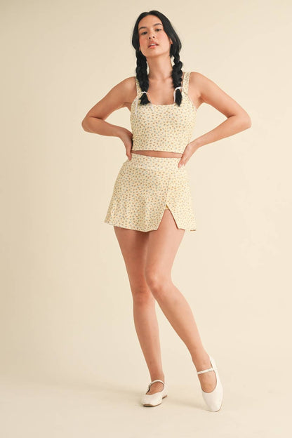 Ditsy print twist-back crop tank top by Kimberly C, featuring a feminine floral pattern and stylish twisted back design.
