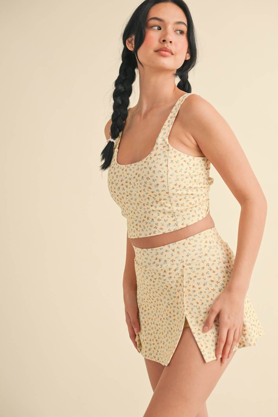 Ditsy print twist-back crop tank top by Kimberly C, featuring a stylish back twist design and lightweight fabric.