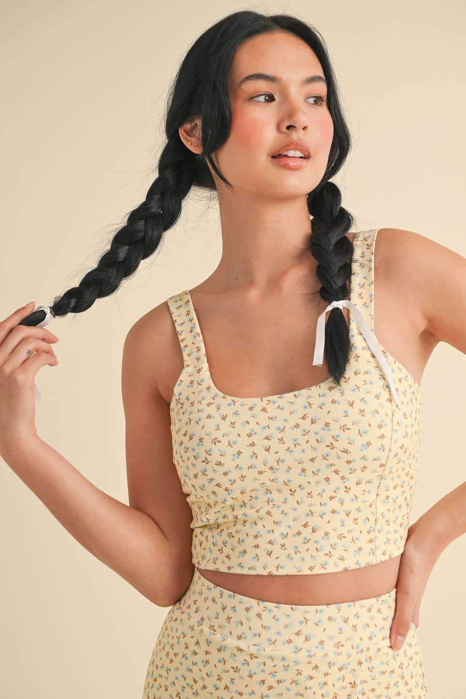 Kimberly C Ditsy Print Twist Back Crop Tank top with floral pattern and twisted back detail, perfect for casual summer wear.