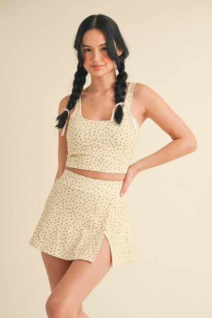 Ditsy print twist-back crop tank top by Kimberly C featuring a lightweight fabric and stylish back twist detail.