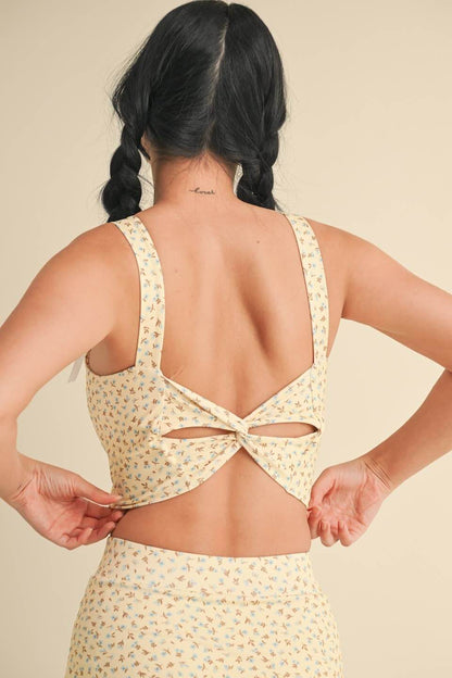 Ditsy print twist-back crop tank top by Kimberly C, featuring a lightweight fabric and stylish back detail.