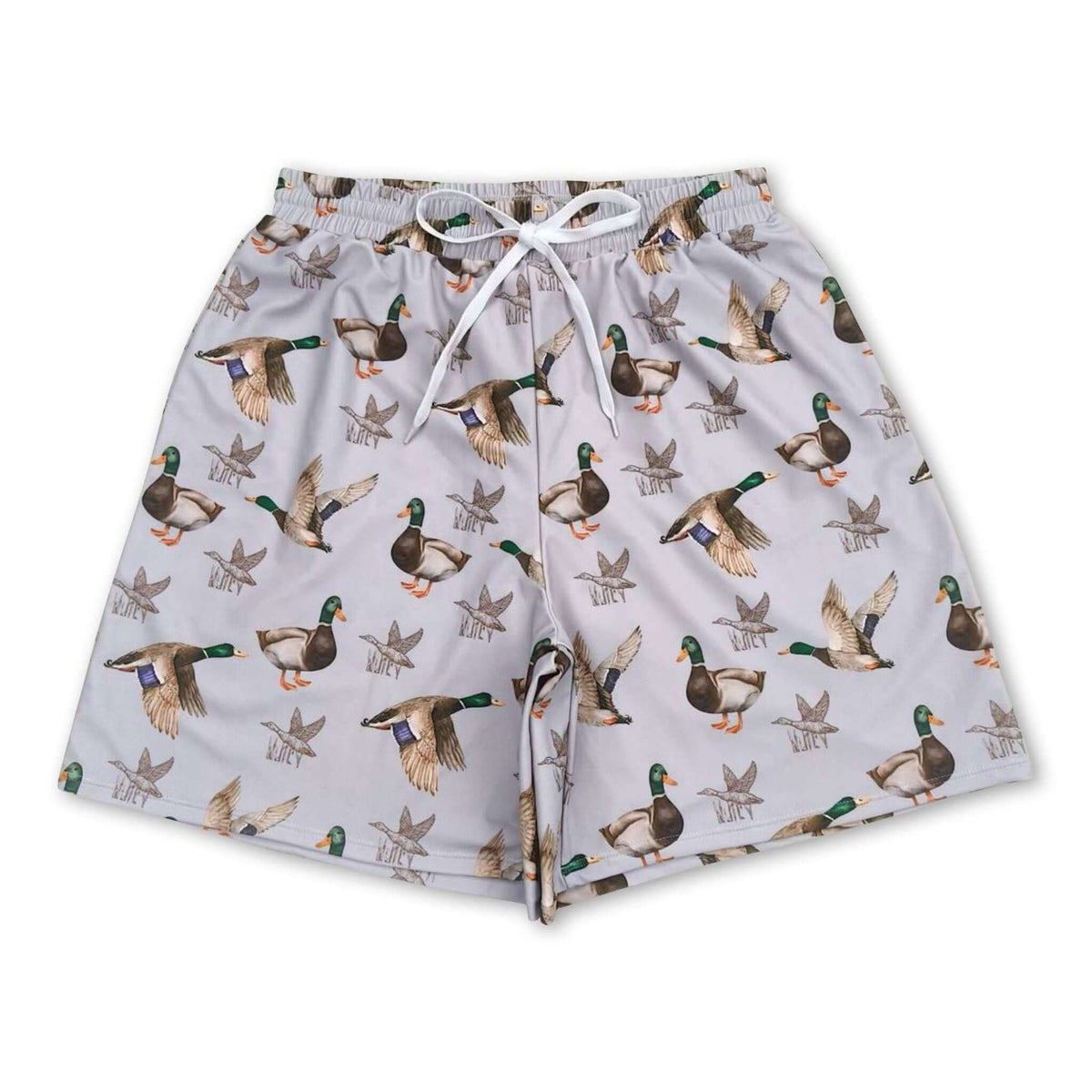 Young boy wearing colorful Duck kids boys summer swim trunks by Yawoo Garments, suitable for beach or pool fun.