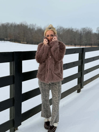 Blue B faux fur coat, stylish outerwear jacket with plush fur texture, ideal for cold weather fashion.
