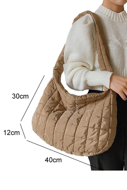 Liam & Company Flynn quilted handbag with top handle, gold-tone hardware, and classic quilted design for versatile style.