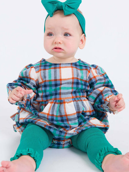Girls emerald green footless ruffle tights for kids and babies, featuring ruffled details and comfortable stretch fabric.
