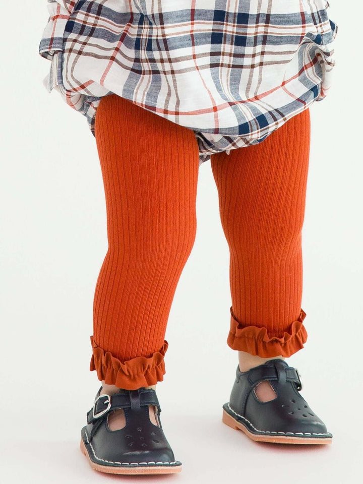 Girls Rust Rib Knit Footless Ruffled Tights from RuffleButts + RuggedButts, featuring a ribbed knit pattern and ruffled details for kids.